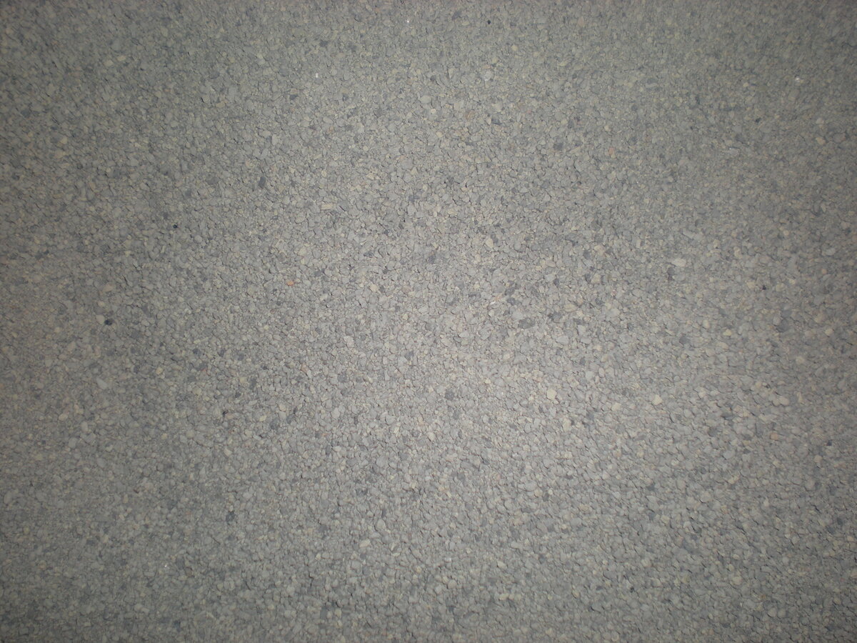 Areia sanitária fresca em close, mostrando textura granular do substrato
